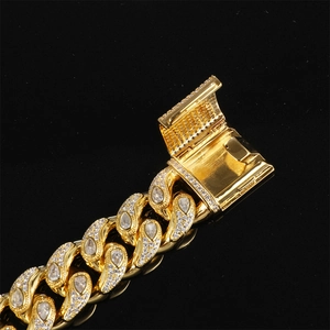 Close-up of golden Cuban link chain with pave-set zircon and secure clasp mechanism