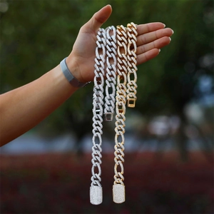Close-up of iced-out gold and silver hip hop necklaces with micro-pave cubic zirconia