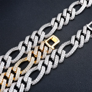 Macro shot of two-tone gold and silver Cuban chain link with paved zircon stones