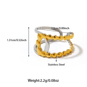 Detail showing two-tone stainless steel open ring with beaded texture and dual bands