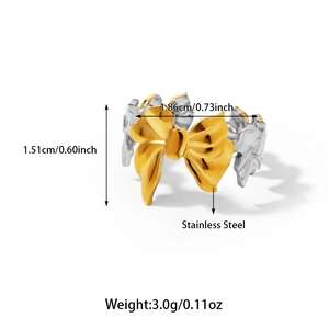 Detail view of two-tone stainless steel bow ring with gold and silver color combination