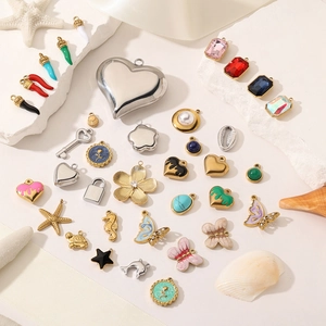 Assorted 18K gold and silver plated DIY jewelry charms with heart and butterfly motifs