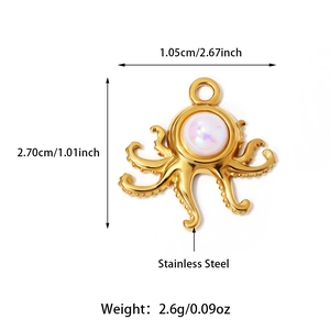 Macro detail of octopus pendant in 18K gold plated stainless steel with iridescent stone