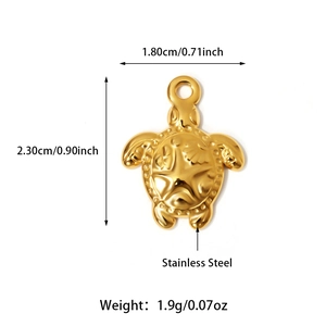 Macro shot of 18K gold-plated stainless steel turtle pendant with shell relief details