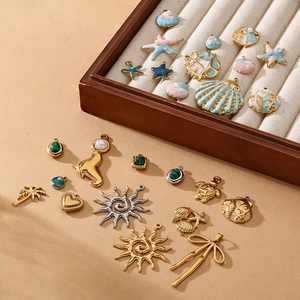 18K gold plated stainless steel ocean charms including starfish and sun pendants