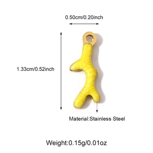 Macro shot of yellow coral-shaped stainless steel pendant with size and weight specs