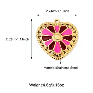 Detailed view of a gold heart pendant with pink floral enamel and dimensions text