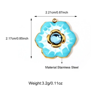 Detailed view of floral stainless steel pendant with blue gemstone and dimensions