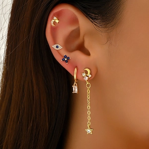 Chic gold celestial earring set with star moon charms and blue evil eye zircon studs