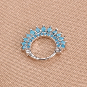 Close-up of silver clicker hoop earring featuring 15 turquoise beads in a fan-shaped setting