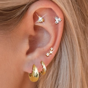 Classic gold cartilage earrings set with zircon studs and hoop piercings for women