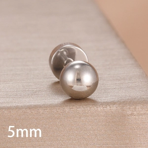 Macro shot of a 5mm silver stainless steel ball stud earring with flat back on textured stand