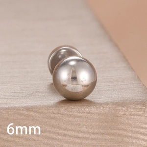 Macro shot of a 6mm polished silver ball stud earring made of smooth stainless steel