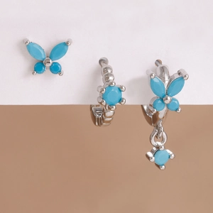 Detailed view of silver butterfly earrings set with turquoise zircon and water drop pendant