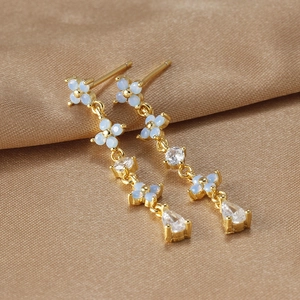 Elegant gold flower drop earrings with blue opal petals and sparkling zircon water drops