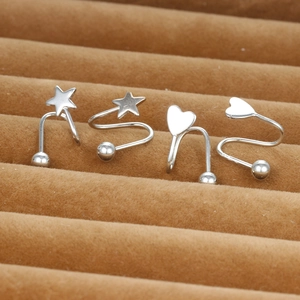 Polished silver heart and star screw back earrings set on brown velvet display