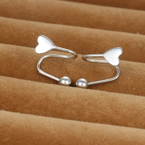 Close-up of S925 sterling silver heart and bead screw earrings on a brown jewelry tray