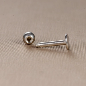 Detail view of silver stainless steel threaded earring post and ball closure part