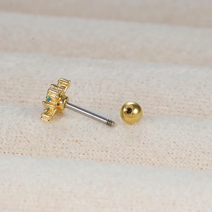 Gold sunflower earrings with blue zircon stones and screw back for tragus cartilage