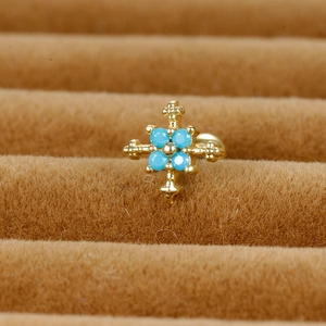 Cross stainless steel stud earring with blue stones on a luxury brown velvet display