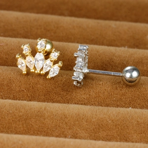 Macro view of crown-shaped stud earrings with cubic zirconia and screw ball backings