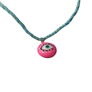 Bohemian braided cord necklace with pink Evil Eye pendant and colorful fiber texture