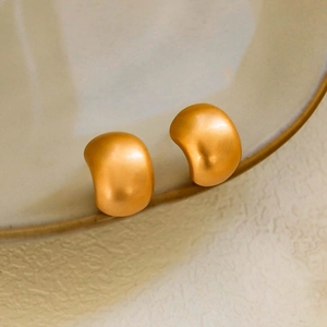 Matte brushed 18K gold bean earrings in irregular curved minimalist stud design