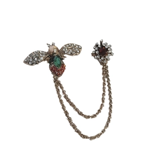 Vintage bee and flower brooch with green gemstone and chain in antique gold finish