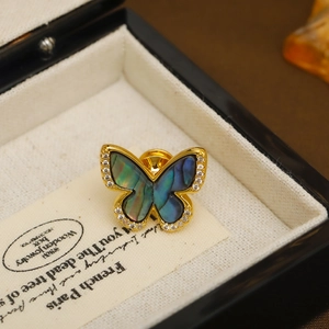 Exquisite golden butterfly brooch with iridescent abalone shell and zircon stones