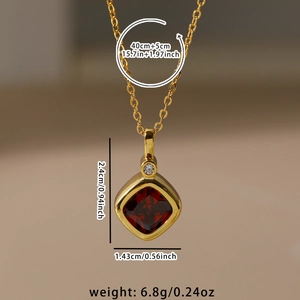 Macro shot of gold necklace with square red gemstone pendant and size specifications