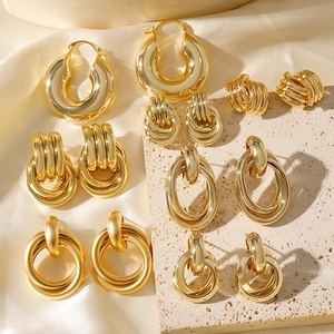 Minimalist 18K gold plated geometric earring set featuring polished hoops and textured studs