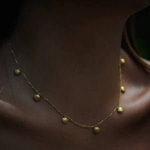 Bohemian gold stainless steel necklace with delicate shell charms for beach vacations