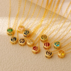 Detail of 12 zodiac pendants with colorful birthstones on gold stainless steel chains