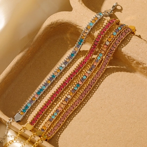Detail of 18K gold-plated bracelets featuring colorful cubic zirconia and lobster clasp