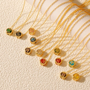 Detailed macro view of 12 zodiac pendant necklaces with colorful zircon stones