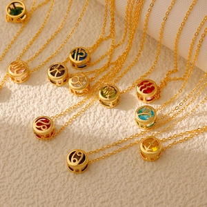 12 Zodiac necklaces with gold hollow frames and multi-colored gemstones in various colors