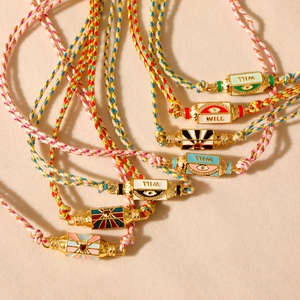 Bracelet tressé tarot bohème avec œil en émail coloré et détails en or et zircone