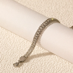 Close-up of double-row tennis bracelet with sparkling zircon stones and lobster clasp