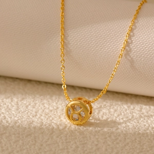Close-up of golden Taurus zodiac necklace with sparkling hollow zircon stone detail
