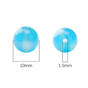 Detail of 10mm light blue resin beads showing 1.5mm hole size for DIY jewelry making