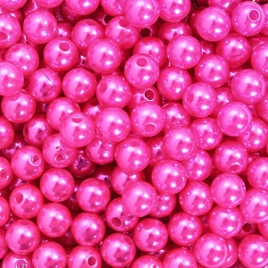 Macro view of hot pink ABS acrylic pearl beads with smooth coating for DIY jewelry