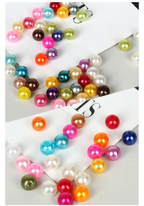 Close-up of colorful round ABS pearl beads with smooth finish for DIY jewelry making