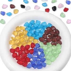 Macro shot of colorful faceted frosted glass beads in a container for DIY jewelry making
