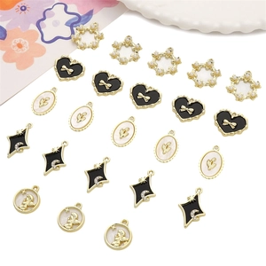 Variety of gold alloy jewelry pendants for DIY handmade earring and necklace crafts.