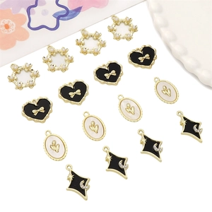 DIY Y2K jewelry charms with heart, star, and flower motifs in gold and enamel finish