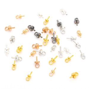 Detailed close-up of mixed color copper bail pins for jewelry and bead accessories