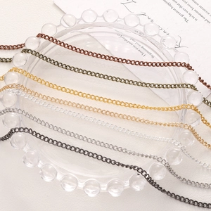 Detail view of 7 colors DIY jewelry extension chains on a transparent glass tray