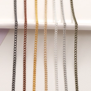 Detail view of seven metallic finished fine chains in gold silver and bronze for jewelry