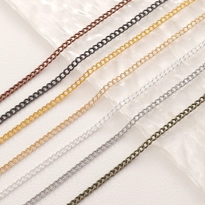 Multiple colors of fine metal link chains for DIY jewelry making on textured glass tray