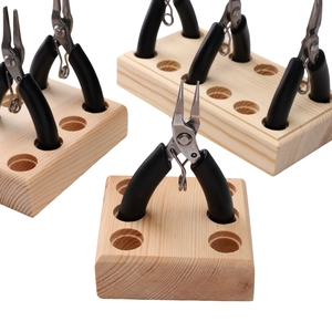 Solid wood pliers storage rack with multiple holes for organizing handmade DIY craft tools